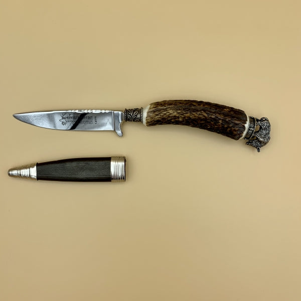 Trachtenmesser „Eber“ mit Horngriff und massiver Kappe mit Eberkopf