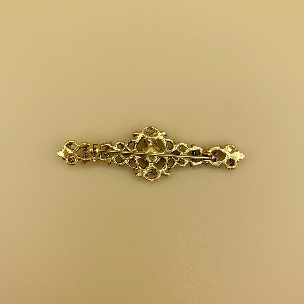 Filigrane Anstecknadel „6“ in Altmessing mit rundem Swarovski®-Kristall in Rubin